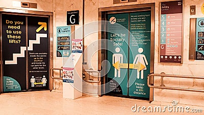 Shopping Centre Lift Doors Posters Health Warnings And Social Distanciing Instructions Editorial Stock Photo