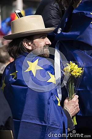 A man with a flower and a Europe flag Editorial Stock Photo