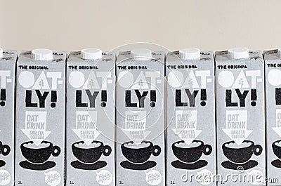 London / UK - March 8th 2021 - Oatly milk cartons in a row. Oatly is a dairy free vegan milk alternative Editorial Stock Photo