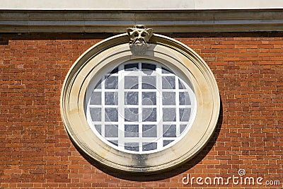 Round window at Hampton Court Palace which was originally built for Cardinal Thomas Wolsey 1515, later Editorial Stock Photo