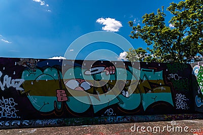 LONDON, UK - MAY 21, 2019 street art paintings panorama on the wall in the park in London, a wall where street artists can present Editorial Stock Photo
