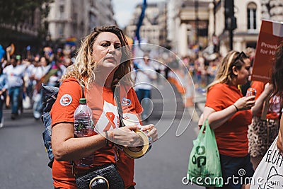 National AIDS trust with flags and banners celebrating London LGBTQ Pride Parade Editorial Stock Photo