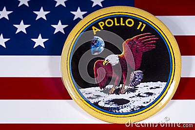 Apollo 11 Badge and the USA Flag Editorial Stock Photo