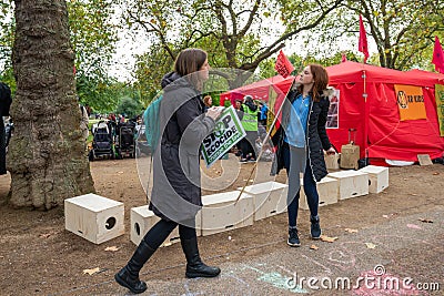 London, UK - October 7, 2019: Extinction Rebellion protesters block traffic on city streets Editorial Stock Photo