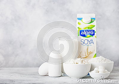 LONDON, UK - OCTOBER 07, 2018 : Plastic bottle of Alpro Soya milk, bowl of cottage cheese and baking flour and mozzarella. Eggs an Editorial Stock Photo