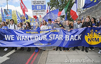 Pro-EU anti-Brexit supporters with main banner at the National Rejoin March in London. Editorial Stock Photo