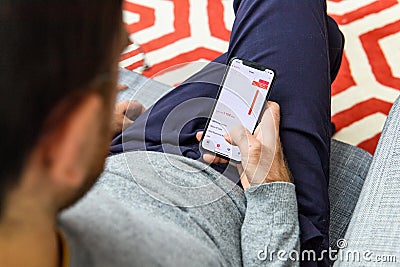 Man using latest iPhone XS unboxing display steps health Editorial Stock Photo