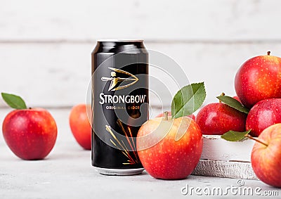 LONDON, UK - SEPTEMBER 13, 2018: Aluminium can of Strongbow Original Cider with fresh apples on wooden background. Editorial Stock Photo