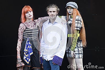 People on the street during the London Fashion Week. Group of brightly dressed friends posing Editorial Stock Photo