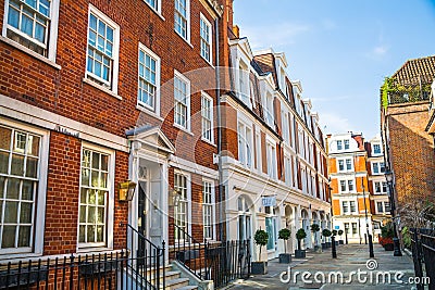 Street view in Mayfair with beautiful periodic buildings. London Editorial Stock Photo