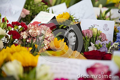 LONDON, UK - September 2022: Thousands of flowers, cards and messages are laid in Green park in tribute to Queen Editorial Stock Photo