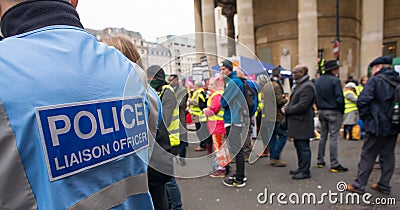 Police liaison officer at a protest demonstration in central London, England. Editorial Stock Photo