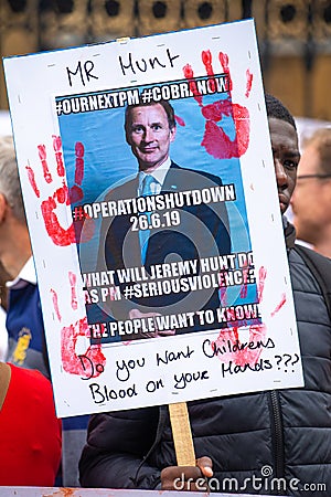 Anti knife crime campaign posters & placards from Operation Shutdown protesting outside the gates of Parliament Editorial Stock Photo