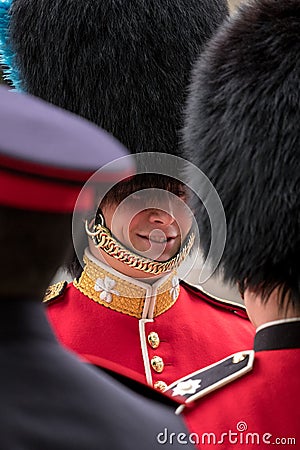 Two Royal Guard soldiers having a friendly chat during the Trooping the Colour military parade, London UK Editorial Stock Photo