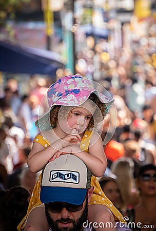 Little girl attending the family day at the Notting Hill Carnival together with ther Editorial Stock Photo