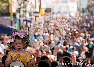 Little girl attending the family day at the Notting Hill Carnival together with ther Editorial Stock Photo