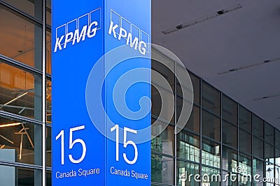 London, United Kingdom - February 03, 2019: Blue KPMG signage at entrance to their offices on 15 Canada Square in Canary Wharf - Editorial Stock Photo