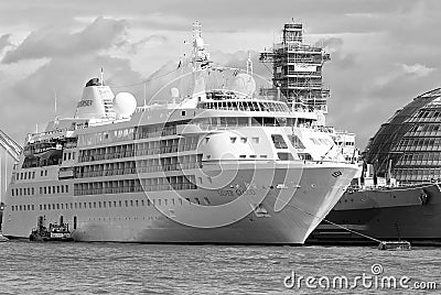 London, United Kingdom - February 25, 2010: ocean liner on water. Cruise ship on cloudy sky. Summer vacation concept Editorial Stock Photo