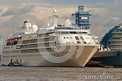 London, United Kingdom - February 25, 2010: ocean liner on water. Cruise ship on cloudy sky. Summer vacation concept Editorial Stock Photo