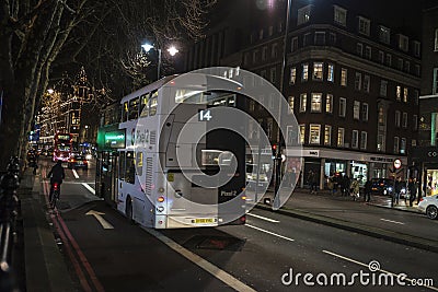 Bus circulating at night in London, England, United Kingdom Editorial Stock Photo