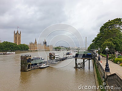 River Thames view from Lambeth Bridge with the Palace of Westminster, House of Commons and London Eye in the background on a Editorial Stock Photo