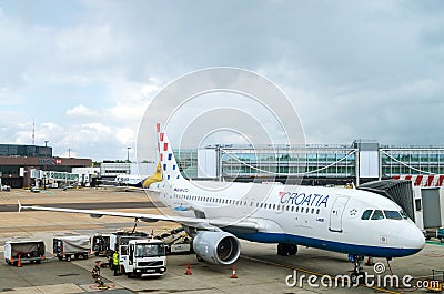 LONDON, UNITED KINGDOM - March 10, 2015: Refueling Croatia Airlines' Airbus A320 on Gatwick airport in London, UK. Editorial Stock Photo
