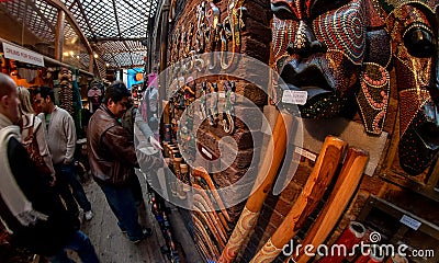 London, United Kingdom - March 31, 2007: Unknown shoppers looking at goods Aboriginal musical instruments at Camden Lock, famous Editorial Stock Photo