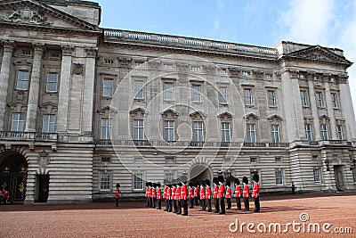 LONDON, UNITED KINGDOM - October 25, 2013: Officers and soldiers of the Coldstream Guards march in front of Buckingham Palace duri Editorial Stock Photo