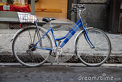 A Lone Bicycle Along the Streets of Florence Editorial Stock Photo