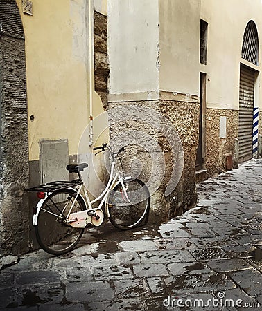 Lone bicycle leaning against a wall Editorial Stock Photo