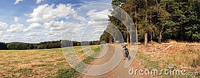 Panorama from lone bicycle parked on a rural road Stock Photo