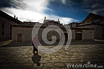 A lone Buddhist monk of Tashilompu Monastery Shigaste Tibet Editorial Stock Photo