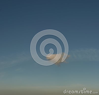 Lone cloud drifting across sky, panorama format Stock Photo