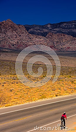 Lone Cyclist at Red Rock Caynon Stock Photo