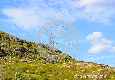 A lone electric iron pole on a hill Stock Photo