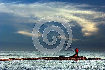 Lone fisherman Stock Photo