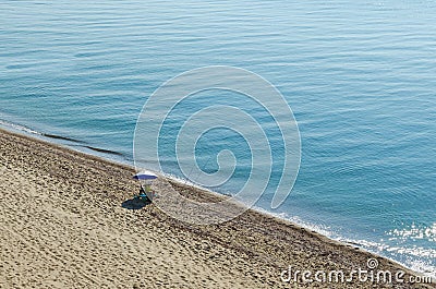 A lone fisherman is fishing on the seashore in the early morning Editorial Stock Photo
