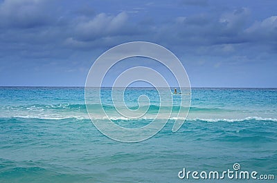 Lone fisherman on his boat in the sea Stock Photo