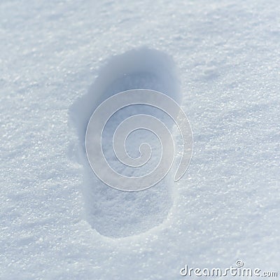 Lone footprint or boot on the snow the next person Stock Photo
