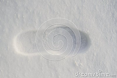 lone footprint or boot on the snow the next person Stock Photo
