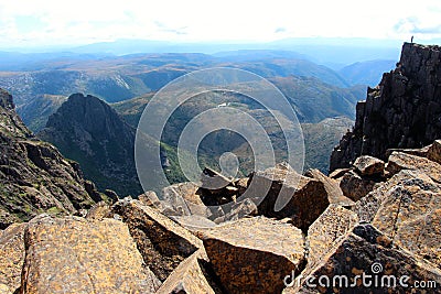 Lone hiker on the the peak of Cradlel mountain Stock Photo