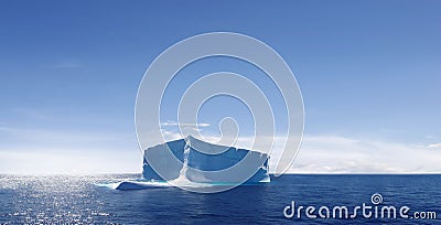 Lone iceberg drifting in ocean Stock Photo