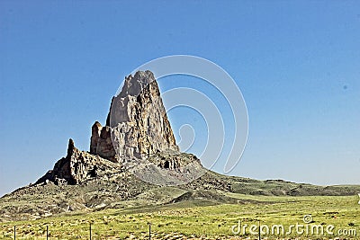 Lone Rock Jutting Out In Monument Valley Stock Photo