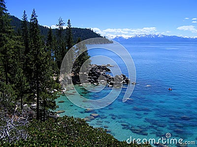 Lone kayaker on pretty Lake Tahoe Stock Photo