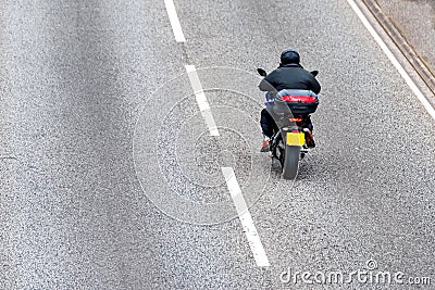 Lone motorcycle on uk motorway in fast motion Stock Photo