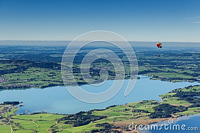 Lone paraglider over the lakes of Bavaria Stock Photo