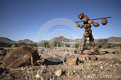 Lone stone man of Kaokoland walking to a gathering at Marble. Kunene Region, Namibia. low angle. Stock Photo