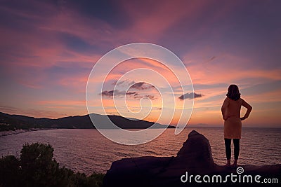 Lone woman contemplating on your vacation in Greece Stock Photo