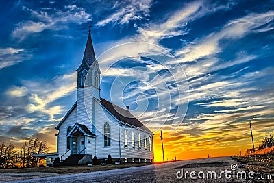 A Lone Wooden Church at Dusk in the Midwestern Prairie - Ellis County, KS USA Stock Photo