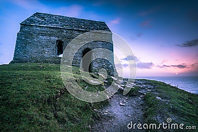 Lonely ancient chapel on Cornish coast,UK Stock Photo